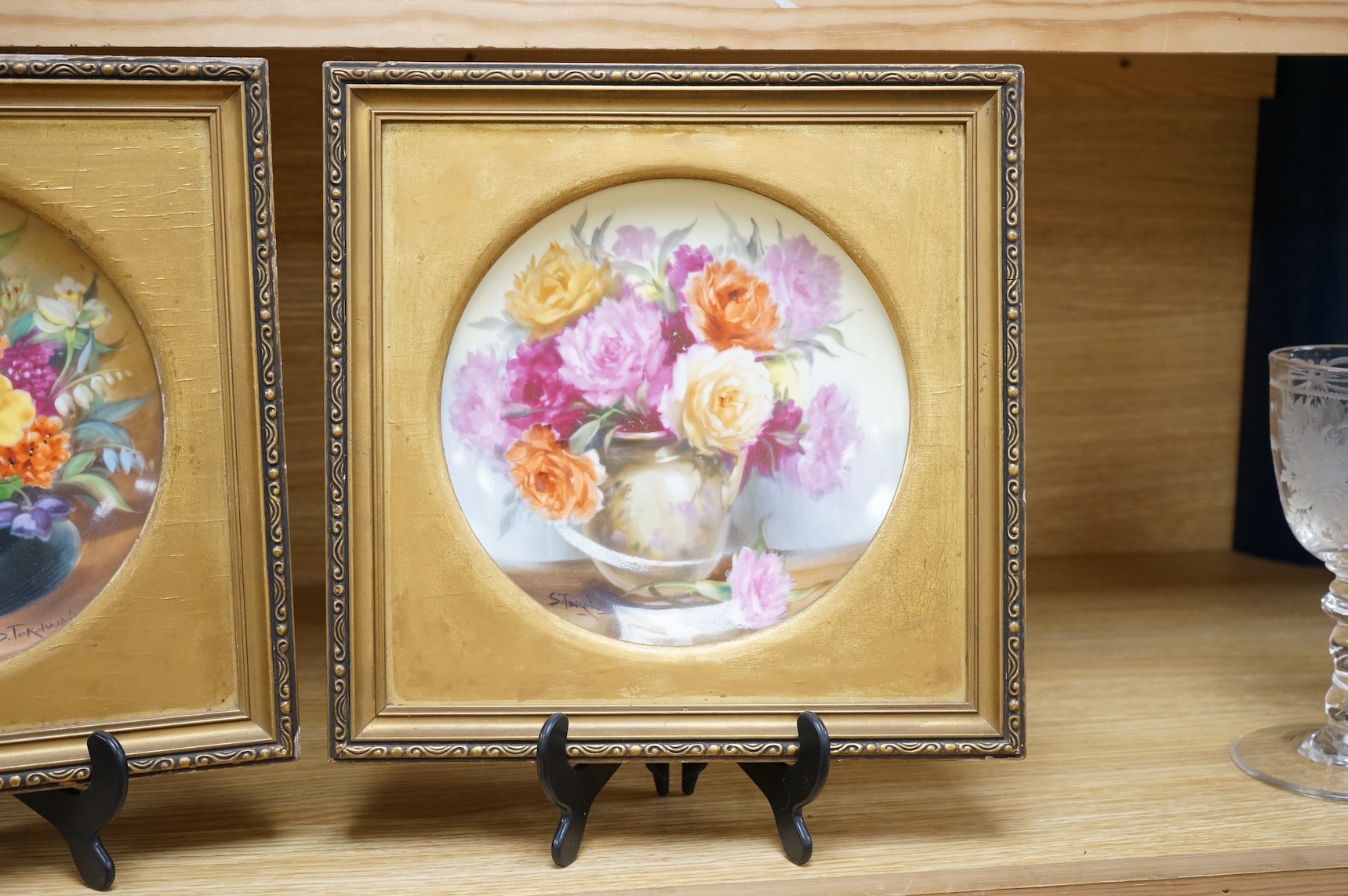 A pair of Noritake floral plates, signed S. Tokohashi, frames in gilt mounts and frames, plates 18.5cm diameter.